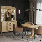 CHAIR: Walker, Maple Wood, 324 Mushroom Leather & 402 Mocha Stain TABLE: Round Top, Standard Edge, Single Madisyn Pedestal, Maple Wood, 410 Honey Stain & Vintage Distressing CASE: Urban Buffet with Hutch, Maple Wood & 410 Honey Stain