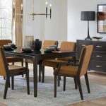 Solid Cosmo Table 4272K000-R in EE standard top in Rustic Cherry and Tropez Leg L30 in 407 Black Silk stain. Dallas Side DAL8214 and Arm Chairs DAL8212 in Rustic Cherry with 407 Black Silk stain and 2407 Camelus fabric. Toulon Server TOUC34SS in Rustic Cherry and 407 Black Silk stain with standard hardware.